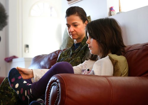 WAYNE GLOWACKI / WINNIPEG FREE PRESS 

Tumia Roberts, 9, and her mother Izabella Roberts at home Wednesday. Tumia wasn't picked up by the school bus Tuesday and was outside for 2.5 hours when her mother found her in their back yard. She describes her cold feet after the ordeal.  Alex Paul  story Jan.11  2017