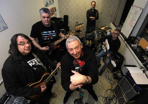 PHIL HOSSACK / WINNIPEG FREE PRESS -  Kevin Mears (front center) fronts "Monuments Galore" posing in a rehearsal space Wednesday evening. Clockwise from the left, Eric Lorene, Art Pearson, Brett Papineau and Duncan Kirkpatrick.   ....January 11, 2017