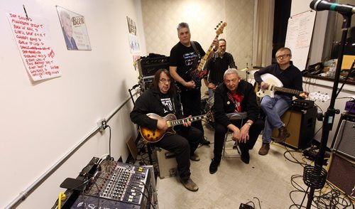 PHIL HOSSACK / WINNIPEG FREE PRESS -  Kevin Mears (front center) fronts "Monuments Galore" posing in a rehearsal space Wednesday evening. Clockwise from the left, Eric Lorene, Art Pearson, Brett Papineau and Duncan Kirkpatrick.   ....January 11, 2017
