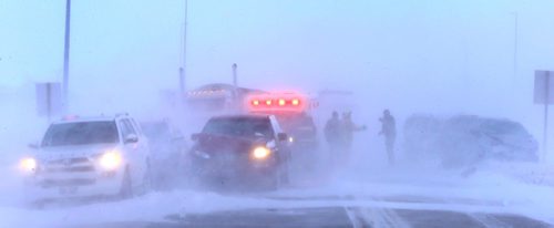 WAYNE GLOWACKI / WINNIPEG FREE PRESS 

Fire Fighters and RCMP at the scene of a aprox. 12-car pileup on  McPhillips St. and the Perimeter Thursday morning in near white out conditions.   Jan.12  2017