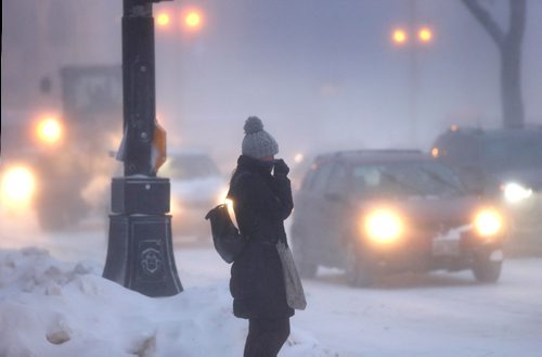 WAYNE GLOWACKI / WINNIPEG FREE PRESS 

A pedestrian faces the¤strong winds and extreme cold along Main St.¤Thursday morning.¤ Jan.12  2017