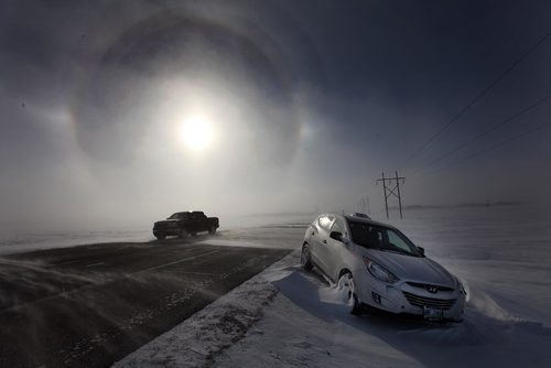 PHIL HOSSACK / WINNIPEG FREE PRESS -  Abandoned vehicles litter highway #3 Thursday, at least 8 were abandoned between Sanford and Oak Bluff and another 9 between Oak Bluff and Fort Whyte after drivers became disorientated in swirling blowing snow and drove off the road.....January 12, 2017
