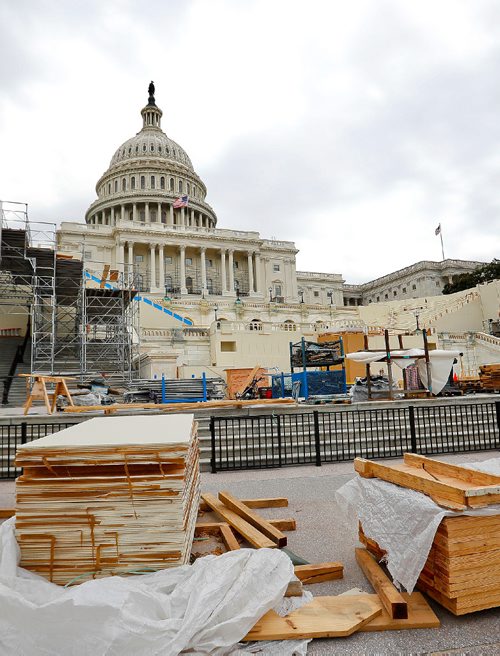 Building materials are stacked as construction continues on the Inaugural platform in preparation for the Inauguration and swearing-in ceremonies for President-elect Donald Trump, Thursday, Dec. 8, 2016, on the Capitol steps in Washington. Trump will be sworn in a president on Jan. 20, 2017. (AP Photo/Pablo Martinez Monsivais)