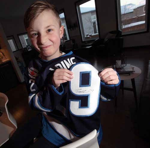 PHIL HOSSACK / WINNIPEG FREE PRESS -  Lucas Bydak had Patrik Laine drop by Thursday evening as a belated birthday surprise.  Laine left Lucas with a signed Jersey, a signed puck and a bag of chocolate covered toffee.....January 13, 2017