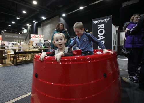RUTH BONNEVILLE / WINNIPEG FREE PRESS

Tiffany Gross (21/2) and her older brother Gabriel (8yrs) check out a two person hot tub at the SpaBerry booth at the Winnipeg Home Renovation Show at RBC Convention Centre Saturday.  

Standup photo 
 Jan 14, 2017
