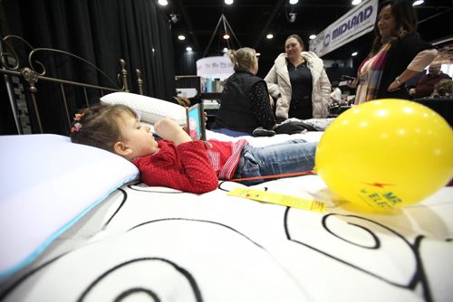 RUTH BONNEVILLE / WINNIPEG FREE PRESS

Mila Pehura (5yrs), tests out a Restonic bed at the Best Sleep Centre booth as her mom and grandmother decide on what to purchase while attending the Winnipeg Home Renovation Show at RBC Convention Centre Saturday.  

Standup photo 
 Jan 14, 2017