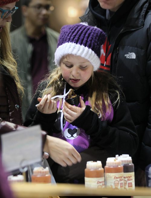 RUTH BONNEVILLE / WINNIPEG FREE PRESS

Skylar Kramer (10yrs) tries out a  taster of pulled beef at the Danny's Whole Hog Catering booth at the Winnipeg Home Renovation Show at RBC Convention Centre Saturday.  

Standup photo 
 Jan 14, 2017