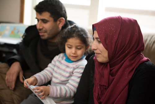 DAVID LIPNOWSKI / WINNIPEG FREE PRESS 

From left: Kamal Alhassan, his daughter Rimus and his wife, Amouna Alhassan gather at the home of Fadel and Rania Ahmad for conversational English classes twice a week January 17, 2017. The refugees from Syria arrived in Canada last February.
