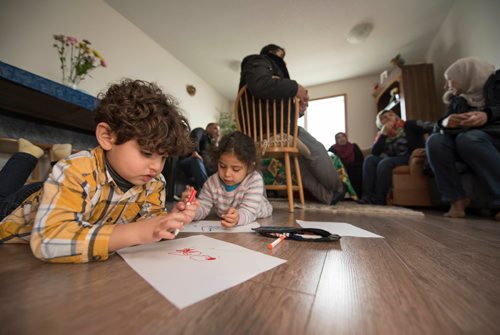 DAVID LIPNOWSKI / WINNIPEG FREE PRESS 

DAVID LIPNOWSKI / WINNIPEG FREE PRESS 

(Left to right) Mohammad Nour and Rimus Alhassan play as their parents take English conversation classes with Val Schellenberg whom volunteers to offer in-home families at the home of Fadel and Rania Ahmad January 17, 2017. The refugees from Syria arrived in Canada last February.
