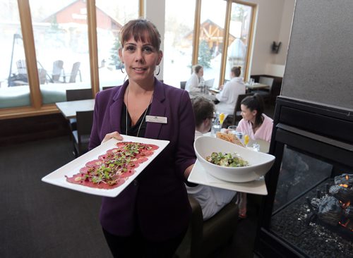 JASON HALSTEAD / WINNIPEG FREE PRESS

Thermëa Winnipeg restaurant manager Carla Foster shows off bison carpaccio (left) and Mushroom and garlic confit with Manitoba Trappist cheese on Jan. 17, 2017. (for restaurant review)