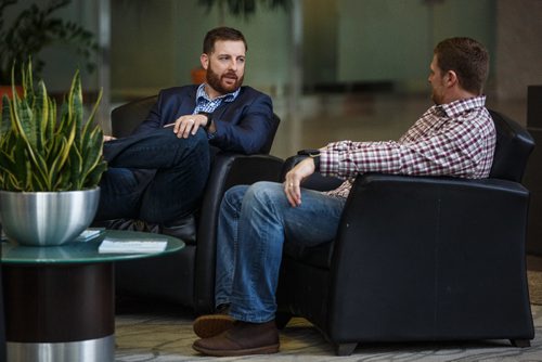 MIKE DEAL / WINNIPEG FREE PRESS
Matt Nichols (left) sits with coach Mike O'Shea (right) in the atrium of the Investors Group building at 447 Portage Ave to talk with the media after he was re-signed as a quarterback for the Winnipeg Blue Bombers.
170118 - Wednesday, January 18, 2017.