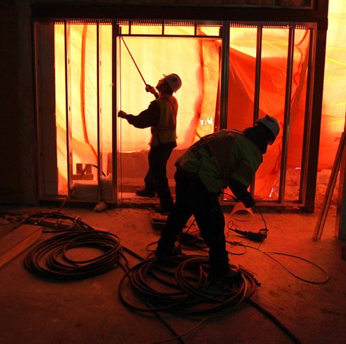 PHIL HOSSACK / WINNIPEG FREE PRESS - Drywall workers measure a site, preparing for new enants at Kildonan Place Mall Thursday. See Murray McNeil story. ....January 19, 2017