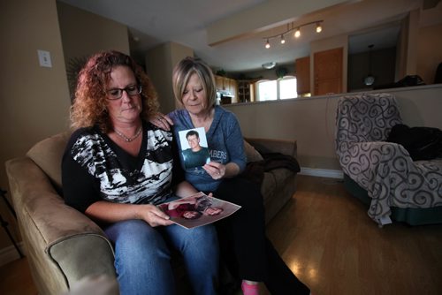 RUTH BONNEVILLE / WINNIPEG FREE PRESS

Colleen Hogue (left) and her older sister, Brenda Managh,  hold photos of their late brother, Robert McAdam, who died while in the Winnipeg Remand Centre.  The sisters spoke out about how he died, which happened after years of alcohol abuse, and explain it was not the fault of the Remand Centre

See story Randy Turner story.  
 Jan 20, 2017