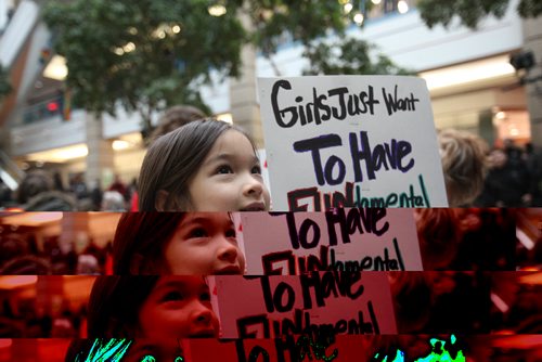 RUTH BONNEVILLE / WINNIPEG FREE PRESS

Young Linny Shaw (7yrs) holds sign with her mom to celebrate with thousands of others at Portage Place during the Women's Day rally and march Saturday.  

 Jan 21, 2017