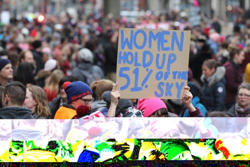 RUTH BONNEVILLE / WINNIPEG FREE PRESS

A young woman holds a sign as she makes her way  with hundreds of others down Portage Ave. Saturday during the  Women's Day March as hundreds of sister marches are being held around the world including Washington.  

 Jan 21, 2017