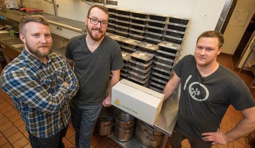 DAVID LIPNOWSKI / WINNIPEG FREE PRESS 

(Left to right) Prairie Box co-owners Brandon Schofield, Lewis Glassey and sous-chef Jon Rosnoski prepare this week's meals in the kitchen of Fionn MacCool's Sunday January 22, 2017. Prairie Box is Winnipeg's first subscription, restaurant-style meal delivery service.
