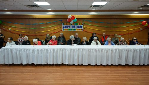 MIKE DEAL / WINNIPEG FREE PRESS
The ten women whose ages when added together equal 1121 take their places with some family members behind them prior to the start of the Centenarian Celebration at the Saul & Claribel Simkin Centre where ten women will be celebrated for their birthdays, all of them at least 100 years old.
170123 - Monday, January 23, 2017.