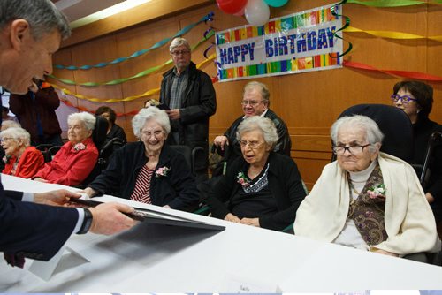 MIKE DEAL / WINNIPEG FREE PRESS
Faye Packer, 100, receives a certificate from member of parliament Terry Duguid during the Centenarian Celebration at the Saul & Claribel Simkin Centre where ten women will be celebrated for their birthdays, all of them at least 100 years old.
(from left) Centenarians pictured are: Ardith Mae Alexander, 106, Fanny Sucharove, 106, Rose Hoffer, 100, Faye Paker, 100, and Sally Baker, 101.
170123 - Monday, January 23, 2017.