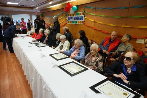 MIKE DEAL / WINNIPEG FREE PRESS
Ardith Mae Alexander, 106, receives a certificate from member of parliament Terry Duguid during the Centenarian Celebration at the Saul & Claribel Simkin Centre where ten women will be celebrated for their birthdays, all of them at least 100 years old.
(from far end of the table) Centenarians pictured are: Ruth Gelfan, 100, Evelyn Golden, 100, Ardith Mae Alexander, 106, Fanny Sucharove, 106, Rose Hoffer, 100, Faye Paker, 100, and Sally Baker, 101, Marjorie Shatzky, 101, Iris Glanville, 102, and Ethel Karr, 104.
170123 - Monday, January 23, 2017.