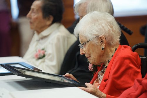 MIKE DEAL / WINNIPEG FREE PRESS
Ardith Mae Alexander, 106, looks at the certificate from member of parliament Terry Duguid during the Centenarian Celebration at the Saul & Claribel Simkin Centre where ten women will be celebrated for their birthdays, all of them at least 100 years old.
170123 - Monday, January 23, 2017.