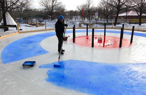 BORIS MINKEVICH / WINNIPEG FREE PRESS
Visual artist James Culleton was brought in to paint the lines on this 16 meter ice installation called "Crokicurl" at The Forks. JAN. 25, 2017