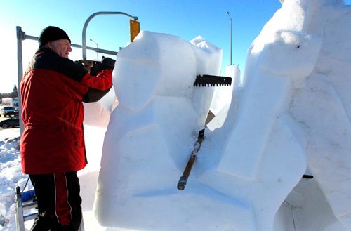 BORIS MINKEVICH / WINNIPEG FREE PRESS
Snow sculpture called "The Musicians" is being carved by Gary Tessier with the assistance from his son André Vrignon-Tessier (not in photo) at the corner of St. Mary's road and Goulet/Marion. JAN. 27, 2017