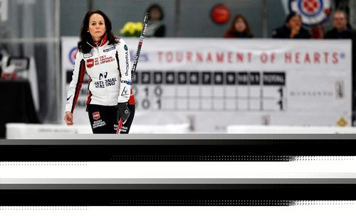 PHIL HOSSACK / WINNIPEG FREE PRESS  - Watching her rock approach the far end, Skip Michelle Englotattepts to add a little "body english" to her delivery Friday afternoon at the Eric Coy Arena, home of this years Scotties. Melissa Martin story....January 27, 2017