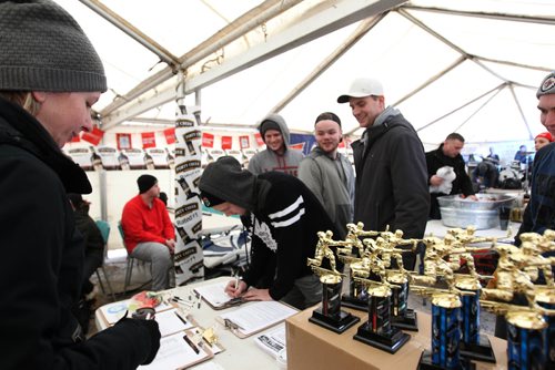 RUTH BONNEVILLE / WINNIPEG FREE PRESS

People line up outside heated tent to signup their team for the 3rd annual Village Winter Classic street hockey festival on Stradbook Ave. Saturday.  Stradbrook Ave. is closed to traffic until after 8pm this evening.  
Standup photo 


 Jan 28, 2017