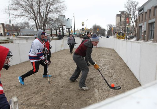 RUTH BONNEVILLE / WINNIPEG FREE PRESS

Teams of 4 people play against each other at the 3rd annual Village Winter Classic street hockey festival on Stradbook Ave. Saturday.  Stradbrook Ave. is closed to traffic until after 8pm this evening.  
Standup photo 


 Jan 28, 2017