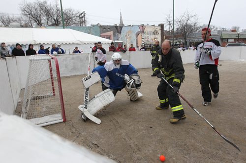 RUTH BONNEVILLE / WINNIPEG FREE PRESS

Teams of 4 people play against each other at the 3rd annual Village Winter Classic street hockey festival on Stradbook Ave. Saturday.  Stradbrook Ave. is closed to traffic until after 8pm this evening.  
Standup photo 


 Jan 28, 2017
