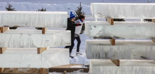 MIKE DEAL / WINNIPEG FREE PRESS
Large blocks of ice for waiting to be made into a warming hut frame skaters as they make their way along the River Trail on the frozen Assiniboine River at The Forks Sunday afternoon.
170129 - Sunday, January 29, 2017.