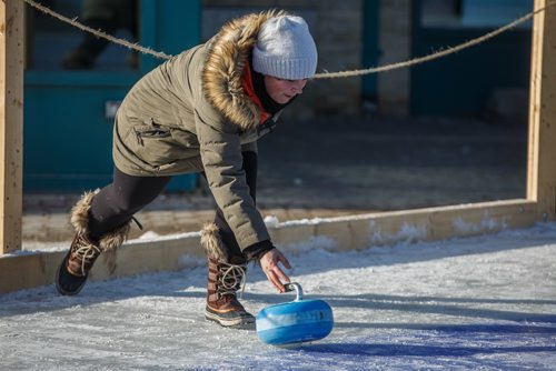 MIKE DEAL / WINNIPEG FREE PRESS
Crystal Salkeld throws a curling rock while playing Croki-curl with his family at The Forks Sunday afternoon.
For 49.8 piece on Crokinole.
170129 - Sunday, January 29, 2017.