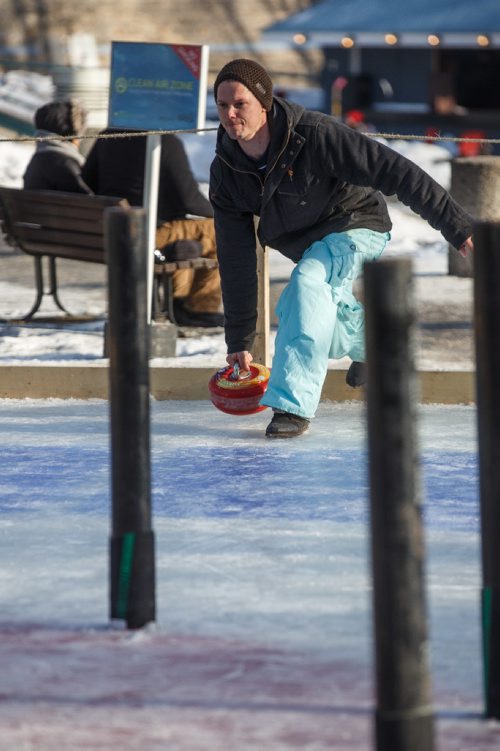 MIKE DEAL / WINNIPEG FREE PRESS
Clayton Salkeld throws a curling rock while playing Croki-curl with his family at The Forks Sunday afternoon.
For 49.8 piece on Crokinole.
170129 - Sunday, January 29, 2017.