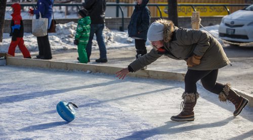 MIKE DEAL / WINNIPEG FREE PRESS
Crystal Salkeld throws a curling rock while playing Croki-curl with her family at The Forks Sunday afternoon.
For 49.8 piece on Crokinole.
170129 - Sunday, January 29, 2017.