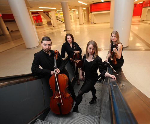 RUTH BONNEVILLE / WINNIPEG FREE PRESS

 Members of the Winnipeg Symphony Orchestra pose for photo in the downtown Hudson Bay basement for an advancer for the WSO concert at The Bay.
Names from left -   Sean Taubner, cello, Elise Lavallée, viola,   Kristina Bauch, violin  (sleeves)  and Meredith McCallum, violin (no sleeves)        
           
           
Jan 27, 2017