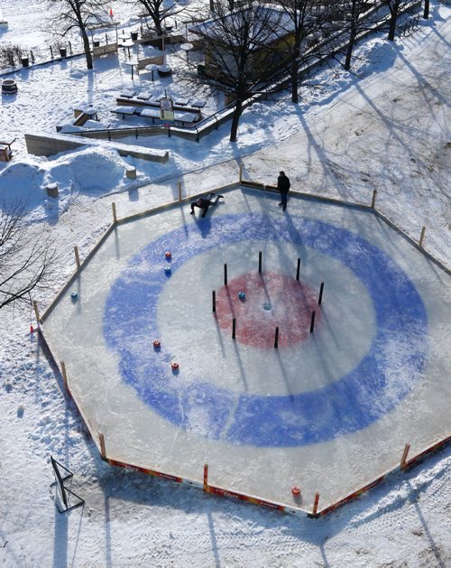 WAYNE GLOWACKI / WINNIPEG FREE PRESS 

49.8 Two fellows throwing rocks on the Crokicurl rink at The Forks.  Feb.1  2017