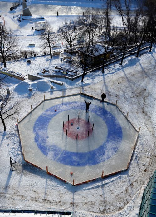 WAYNE GLOWACKI / WINNIPEG FREE PRESS 

49.8 Two fellows throwing rocks on the Crokicurl rink at The Forks.  Feb.1  2017