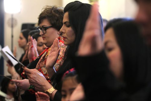 RUTH BONNEVILLE / WINNIPEG FREE PRESS

Landed immigrants hold up their right hand as they recite an oath to become Canadian citizens at Citizenship Ceremony at the Legislative Building Wednesday afternoon.  

Feb 01, 2017
