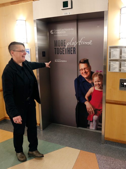 WAYNE GLOWACKI / WINNIPEG FREE PRESS 

Saturday Special. Manitoba cancer patient, Lisa Babey  points to the elevator door with her photo on it while on the  Day in the Life of a Cancer Patient tour  at CancerCare Manitoba.  This was on the media tour Friday at CancerCare Manitoba for World for Cancer Day on Feb.4. Randy Turner story   Feb. 3  2017