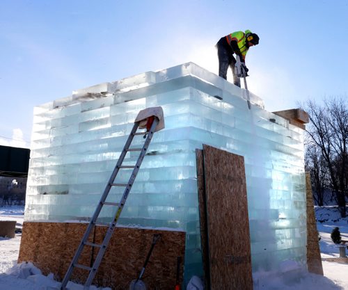 WAYNE GLOWACKI / WINNIPEG FREE PRESS 


The Warming Hut called Stackhouse by Anish Kapoor of London, England is taking shape as a worker trims a block of ice with a chainsaw in the clear cold morning Friday.  This invited submission is being built at The Forks near the Assiniboine River, the  five-metre-square ice hut will have an entrance that resembles a space portal.   Feb. 3  2017