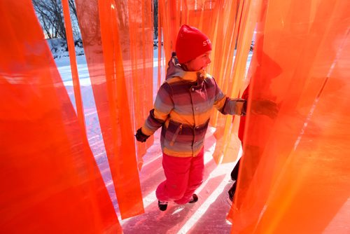 RUTH BONNEVILLE / WINNIPEG FREE PRESS

Éloïse Nayet (9yrs) is all smiles as she makes her way through - Open Border warming hut, a wall made out of  translucent strips of orange plastic strips hanging like a wall across the River Trail along the Assiniboine River.  
atelier ARI's open border installation in canada defies political tensions
responding to the tensed political climate spreading across the world, rotterdam based atelier ARI unveils a brightly red installation set across the assiniboine river in winnipeg, canada. stretching almost four meters in height, the wall titled open border creates a striking contrast against the white snowy landscape and the sinuous ice skating trail through which it cuts perpendicularly.
See Jen Zoratti's story.  
Feb 03,, 2017
