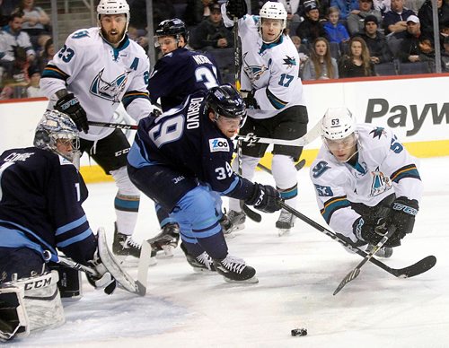 PHIL HOSSACK / WINNIPEG FREE PRESS  - Manitoba Moose netminder Eric Comrierolls watches #39 Dan DesSalvo foil San Jose Barracuda #53 Nikita Jevpalovs in first period action at the MTS Centre Friday evening. - February 3, 2017