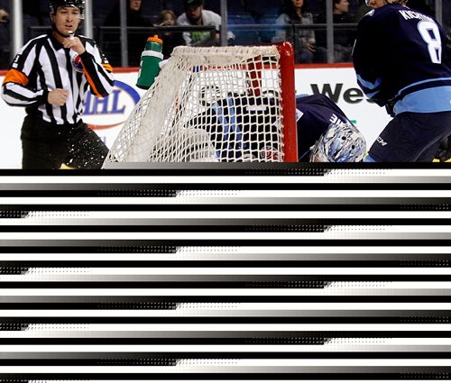 PHIL HOSSACK / WINNIPEG FREE PRESS  - Manitoba Moose netminder Eric Comrierolls into his net behind San Jose Barracuda #52 Adam Helewka in first period action at the MTS Centre Friday evening. - February 3, 2017