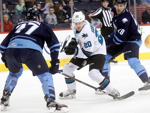 PHIL HOSSACK / WINNIPEG FREE PRESS  - Manitoba Moose #27 Kevin Czuczman and #28Patrice Cormier flank  San Jose Barracuda #20 Marcus Sorensen following the puck in first period action at the MTS Centre Friday evening. - February 3, 2017