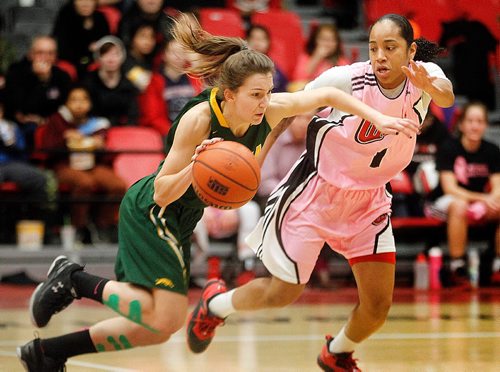 PHIL HOSSACK / WINNIPEG FREE PRESS  -  U of W Wesmen's #1 Antoinette Miller dogs Regina Cougar #4 Avery Pearce Friday evening at the Duckworth Centre - AGATE PAGE - February 3, 2017
