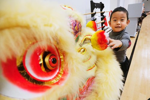 JOHN WOODS / WINNIPEG FREE PRESS
Will Lin looks at the Chinese New Year celebration at the Chinese Cultural  Centre Sunday, February 5, 2017.