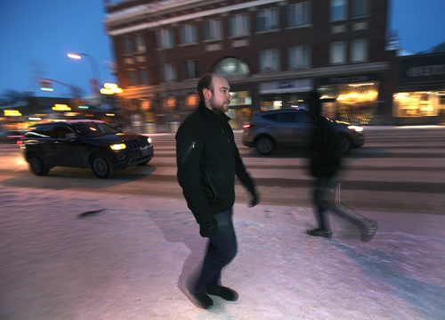 PHIL HOSSACK / WINNIPEG FREE PRESS  -  Robert Keizer is a young, adult resident of Osborne Village, and chose the area for its walkability.  He walks along osborne in the "Village" neighborhood he calls home. Kelly Taylor story. - February 7, 2017