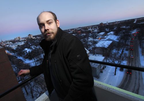 PHIL HOSSACK / WINNIPEG FREE PRESS  -  Robert Keizer is a young, adult resident of Osborne Village, and chose the area for its walkability.  He poses on his balcony overlooking the "Village neighborhood he calls home. Kelly Taylor story. - February 7, 2017