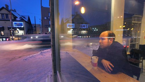 PHIL HOSSACK / WINNIPEG FREE PRESS  -  Robert Keizer is a young, adult resident of Osborne Village, and chose the area for its walkability.  He wwams up woith a coffee in the "Village" neighborhood he calls home. Kelly Taylor story. - February 7, 2017