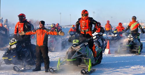 WAYNE GLOWACKI / WINNIPEG FREE PRESS 

Eighty riders from Canada and the U.S. were warming up their engines at the start of the 2017 USXC I-500 cross country snowmobile race from Winnipeg to Bemidj, MN. in the -29C temperature Wednesday morning. Draper Lundquist directs the next 2 riders to the starting line at the Red River Co-op Speedway, this race has some of the worlds best snowmobile racers competing for more than 500 miles over some of the toughest terrain Mother Nature can create. Feb. 8  2017